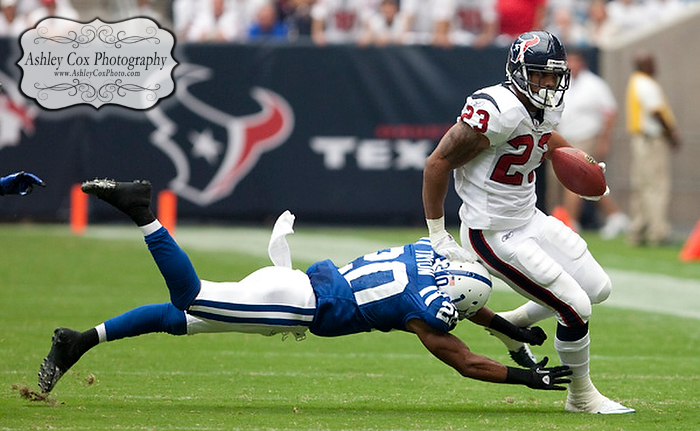 Houston Texans running back Arian Foster slips past Justin Tyron on a six yard reception in the first quarter of a football game against the Indianapolis Colts on Sunday afternoon September 12, 2010 at Reliant Stadium in Houston. The Texans defeated the Colts 34-24 in the season opener.