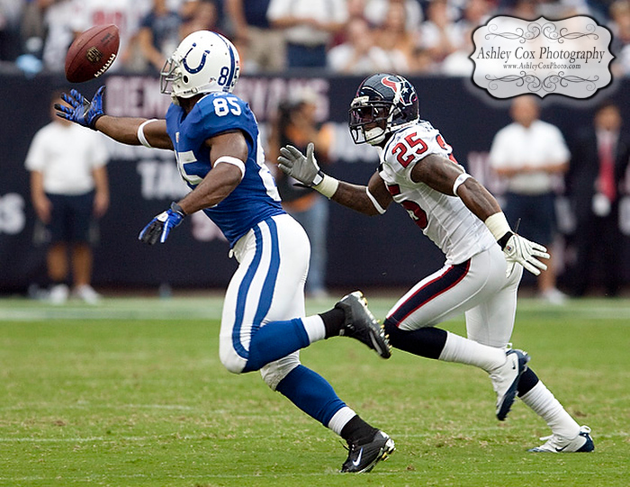 Indianapolis Colts wide receiver Pierre Garcon drops a pass while defended by Houston Texans defensive back Kareem Jackson in the second quarter of a football game on Sunday afternoon September 12, 2010 at Reliant Stadium in Houston. The Texans defeated the Colts 34-24 in the season opener.