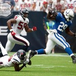 Indianapolis Colts running back Joseph Addai slips past Houston Texans safety Eugene Wilson on a rush in the first quarter of a football game against the Indianapolis Colts on Sunday afternoon September 12, 2010 at Reliant Stadium in Houston. The Texans defeated the Colts 34-24 in the season opener.